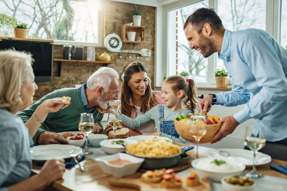 multigenerational family eating together